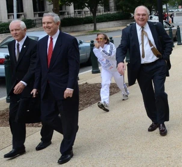 Mimes in Google Track suits follow executives on Capitol Hill in 2011