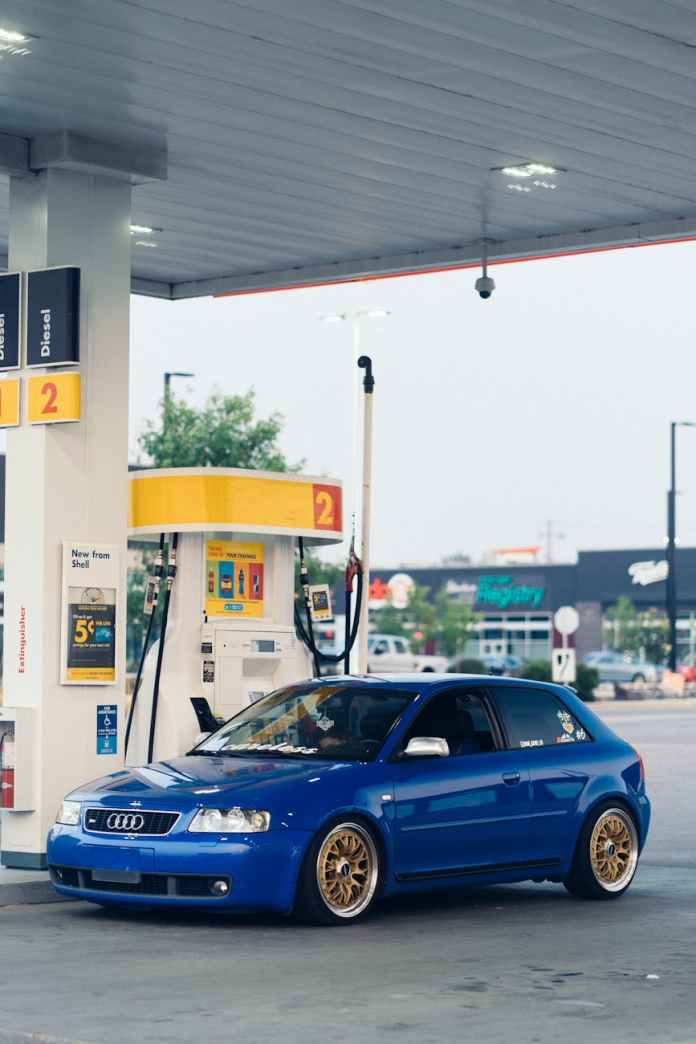 blue car parked on gas station