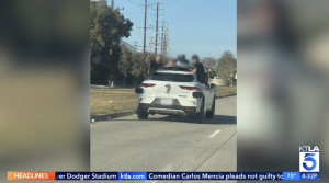 KTLA: Teens Ride On Side Of Waymo Vehicle